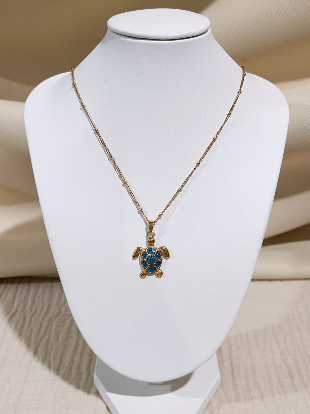 Gold Turtle Pendant Necklace with Blue Shell Accent